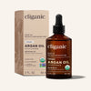 Cliganic argan oil bottle and packaging on a beige background