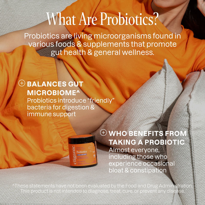 Person wearing an orange shirt with text about probiotics on a gray background