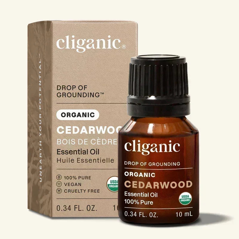 Cliganic Organic Cedarwood Essential Oil bottle with product box, highlighting steam-distilled purity.