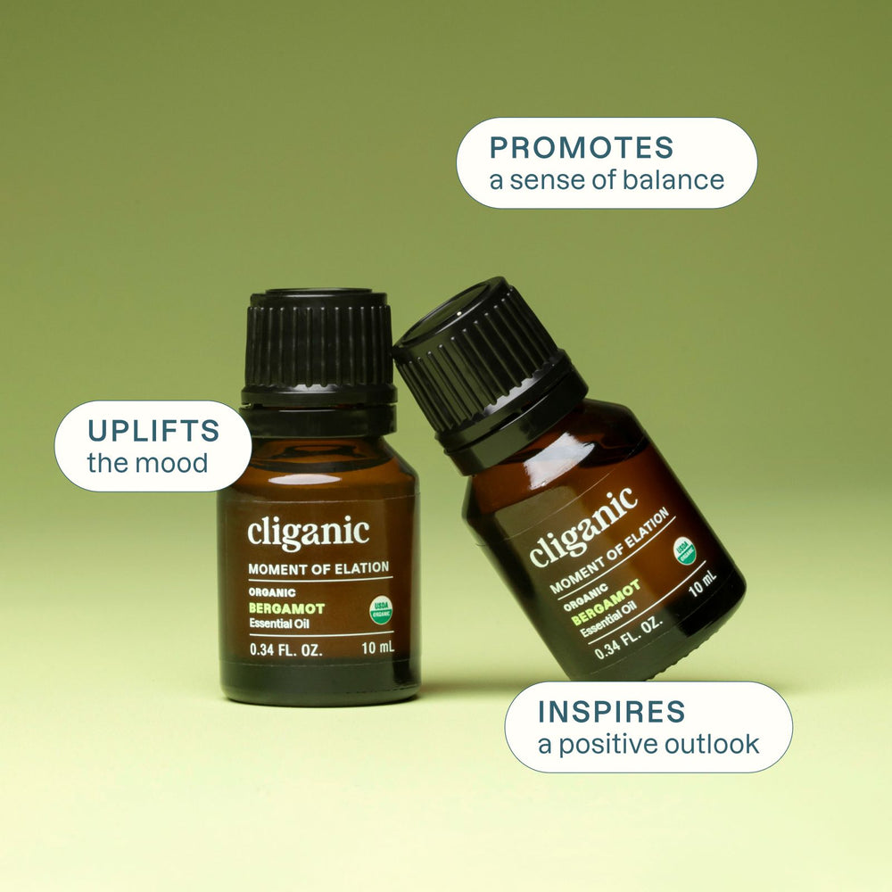 Two bergamot essential oil bottles with feature callouts on a soft green wellness-themed background.