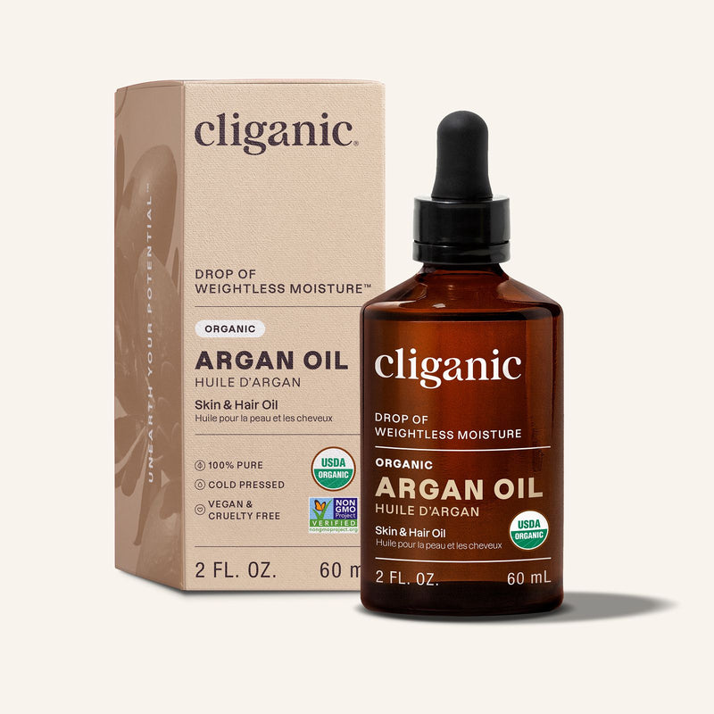 Cliganic argan oil bottle and packaging on a beige background