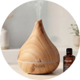 wooden aromatherapy  diffuser with a bottle of essential oil on the side