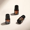 Three Cliganic essential oil bottles arranged on a neutral background showcasing the Beginner's Essential Oil Kit.