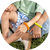 Family wearing colorful mosquito repellent bracelets outdoors for natural insect protection.