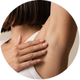 Close-up of a person's shoulder and neck illustrating skin-friendly deodorant use.