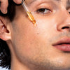 Man applying facial serum for radiant and hydrated-looking skin