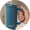 Person holding blue tumbler cup indoors, highlighting ergonomic handle and usability.