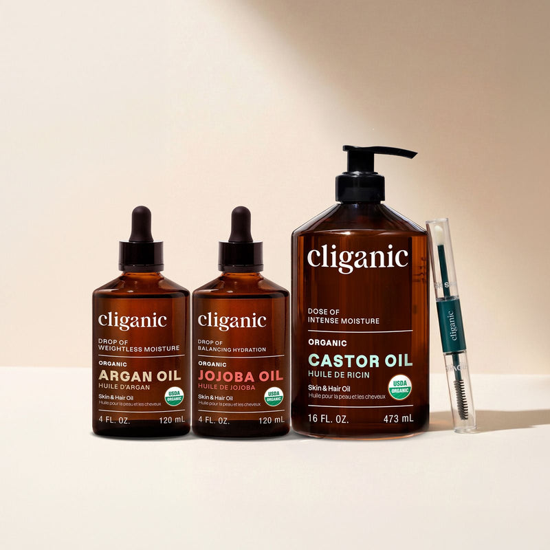 Bottle of organic argan oil with dropper, commonly used as a carrier oil for skin and hair care.